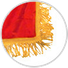 Close-up of gold fringe finishing the red edge of a parade flag